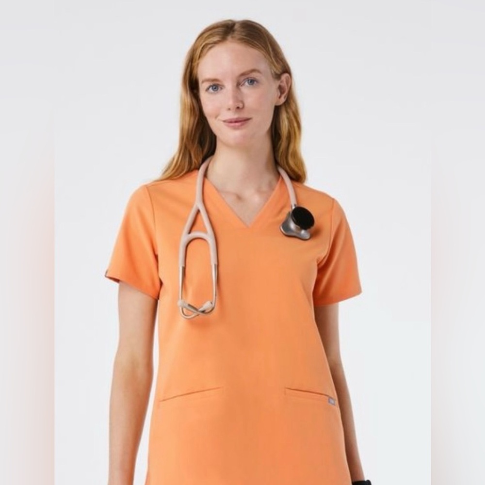FIGS Catarina Three pocket scrub top In Shaka Orange